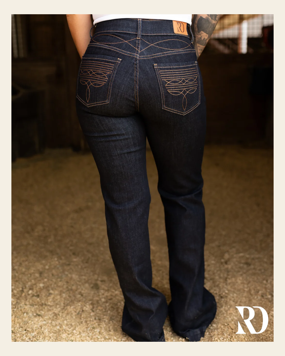 Cheyenne Trouser - Dark Wash on a warm cream background