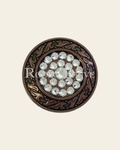 Clear Copper 1.5" Disc European Crystal Concho- on a warm cream background