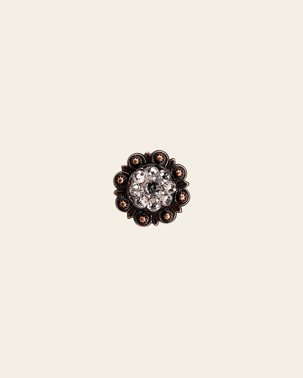 Clear Copper 1" European Crystal Concho on a warm cream background