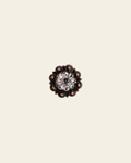 Clear Copper 1" European Crystal Concho on a warm cream background