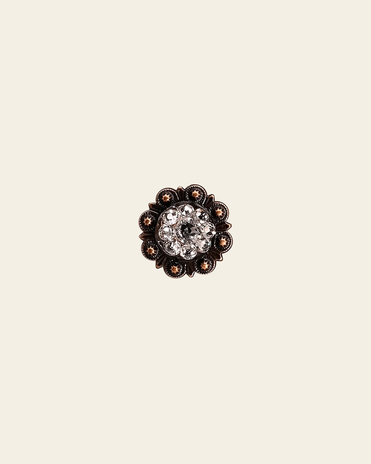 Clear Copper 1" European Crystal Concho on a warm cream background