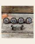 Copper AB & Black Saddle Conchos on a warm cream background