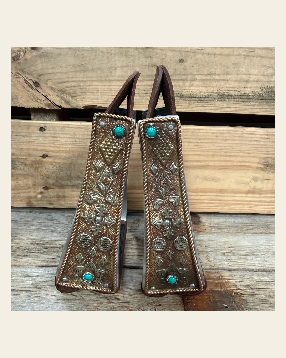 Hand Engraved Copper and Turquoise Barrel Racing/Trail Western Stirrups BRS100 on a warm cream background