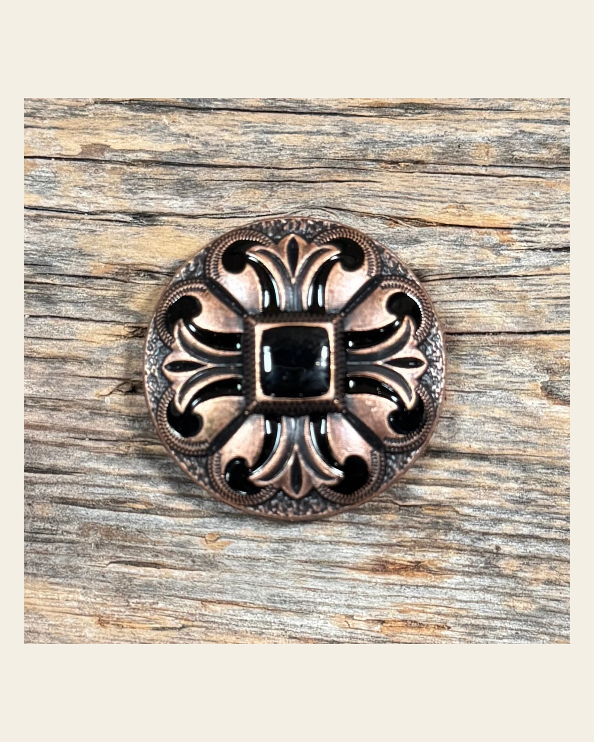 Copper Black Fleur De Lis Concho 1.25” W241L on a warm cream background