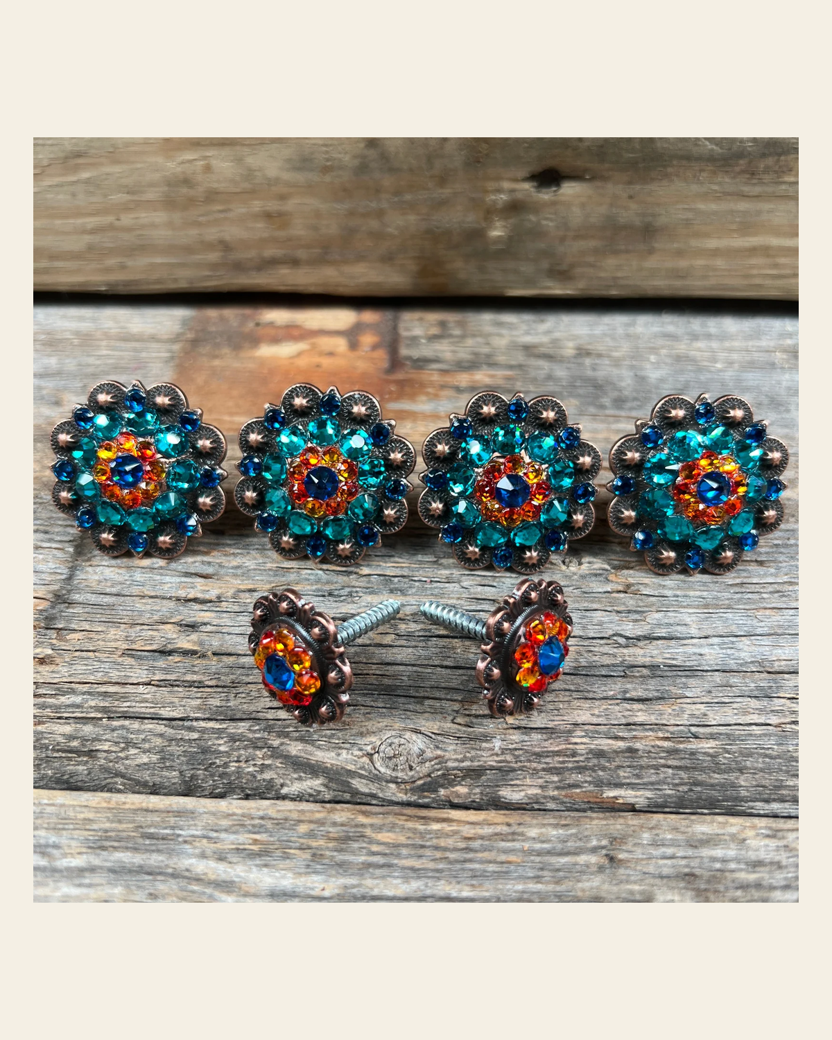 Copper Capri Fire Opal & Teal Saddle Conchos on a warm cream background