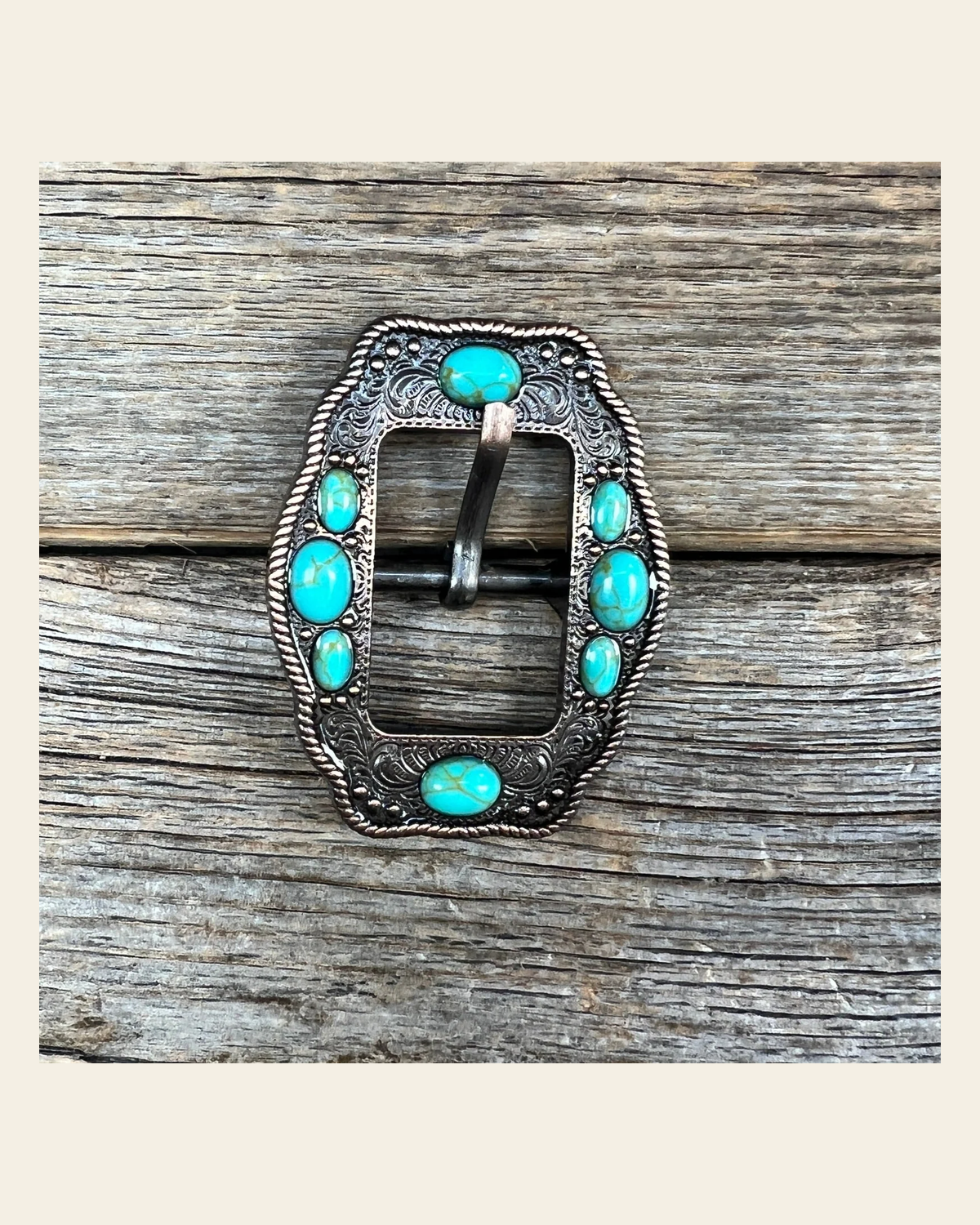 Copper Cart Buckle with Turquoise Stones W195B on a warm cream background
