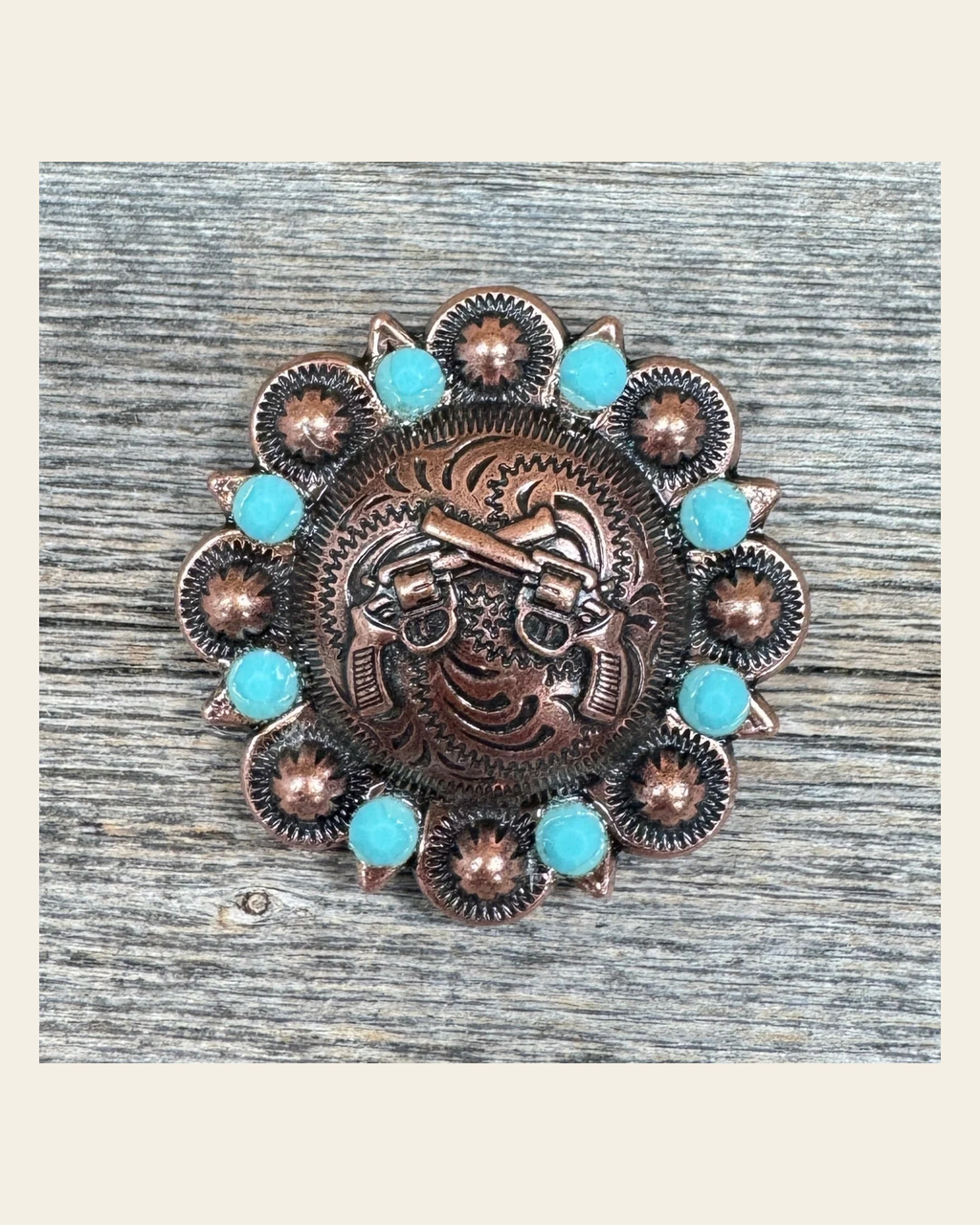 Copper Double Pistol Turquoise Concho 1.5” W242L on a warm cream background