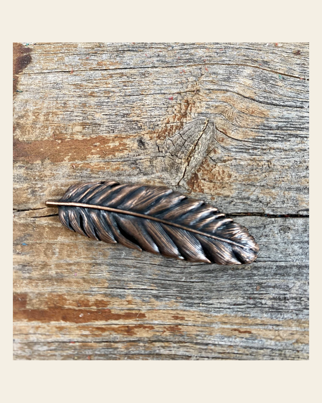 Copper Feather Concho 2" W169S on a warm cream background