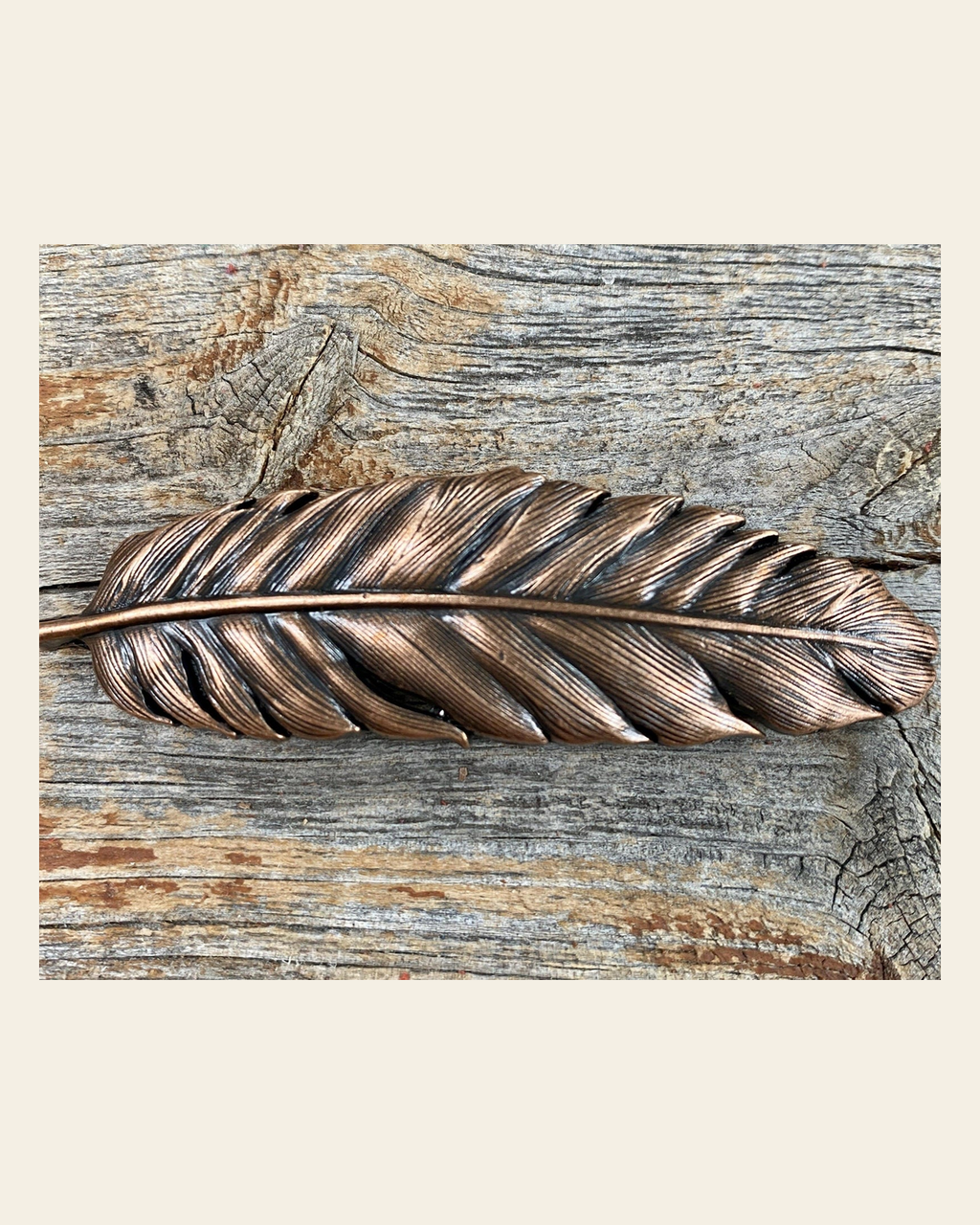 Copper Feather Concho 3" W169L on a warm cream background