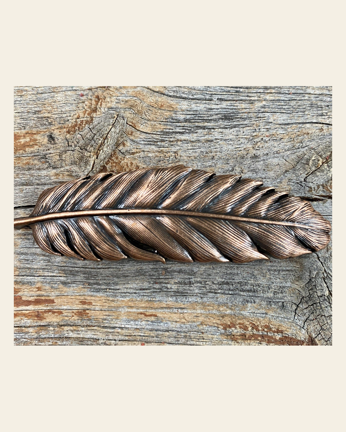 Copper Feather Concho 3" W169L on a warm cream background