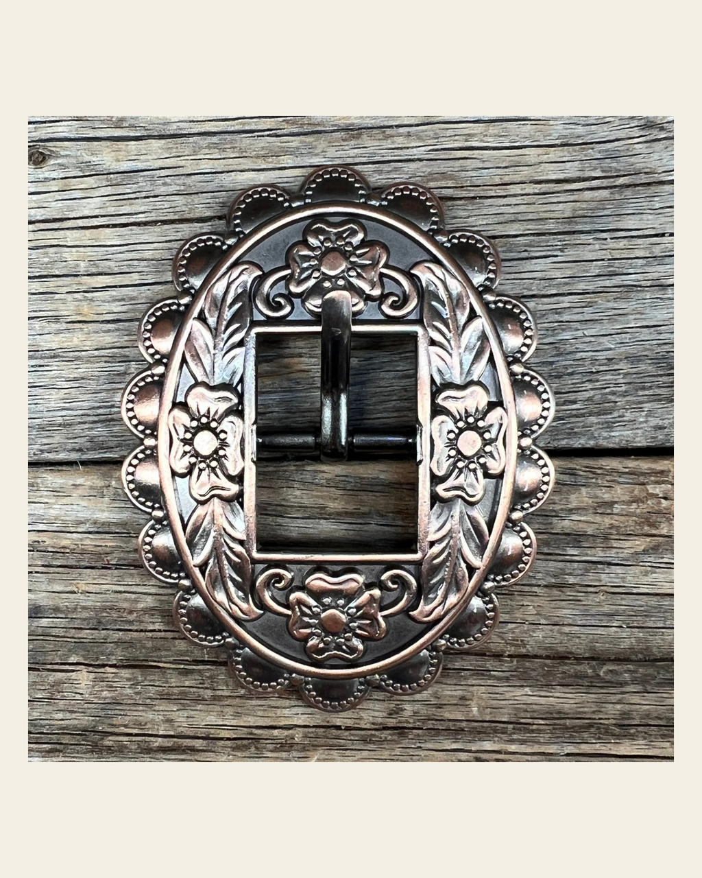 Copper Floral Cart Buckle W197B on a warm cream background