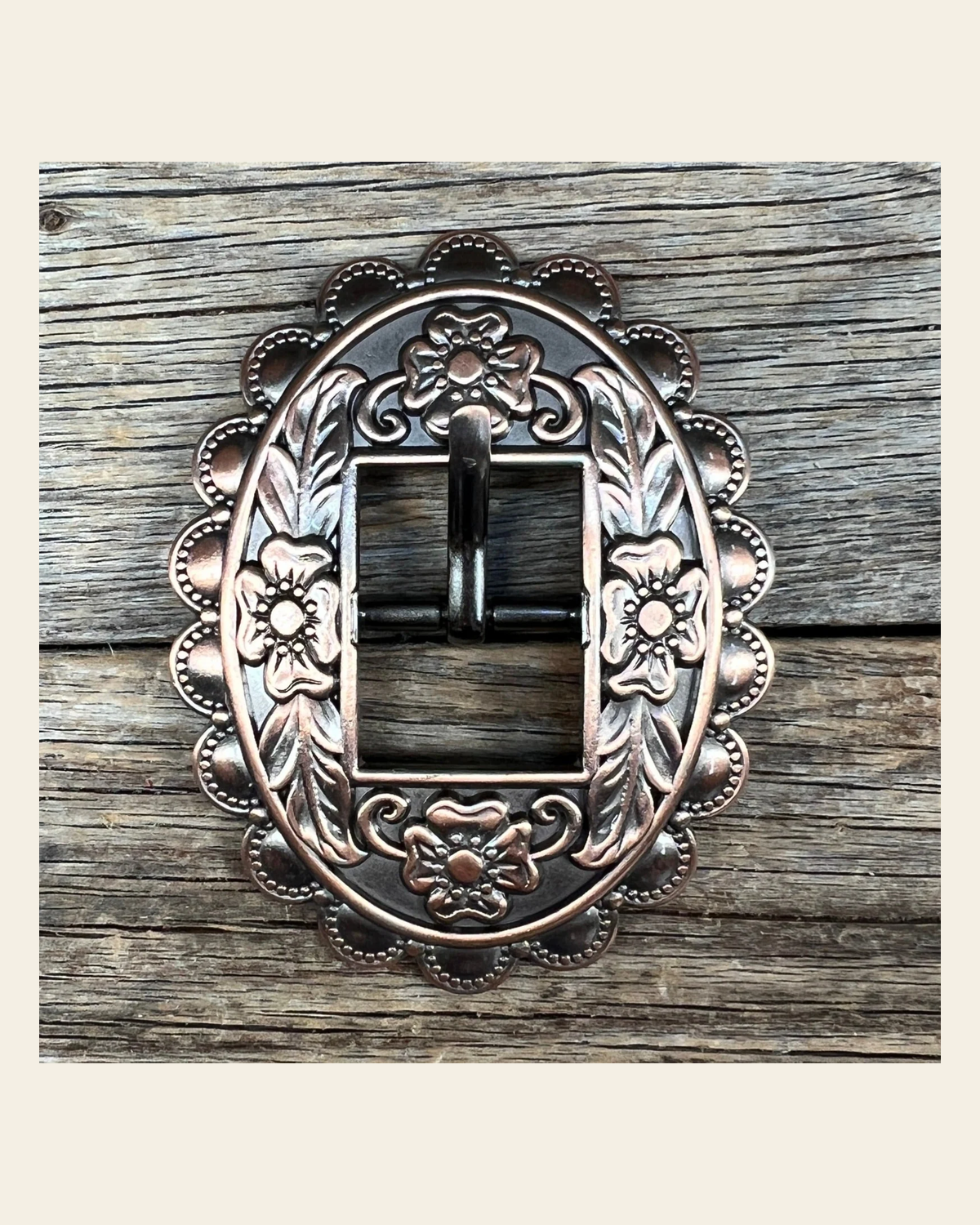 Copper Floral Cart Buckle W197B on a warm cream background