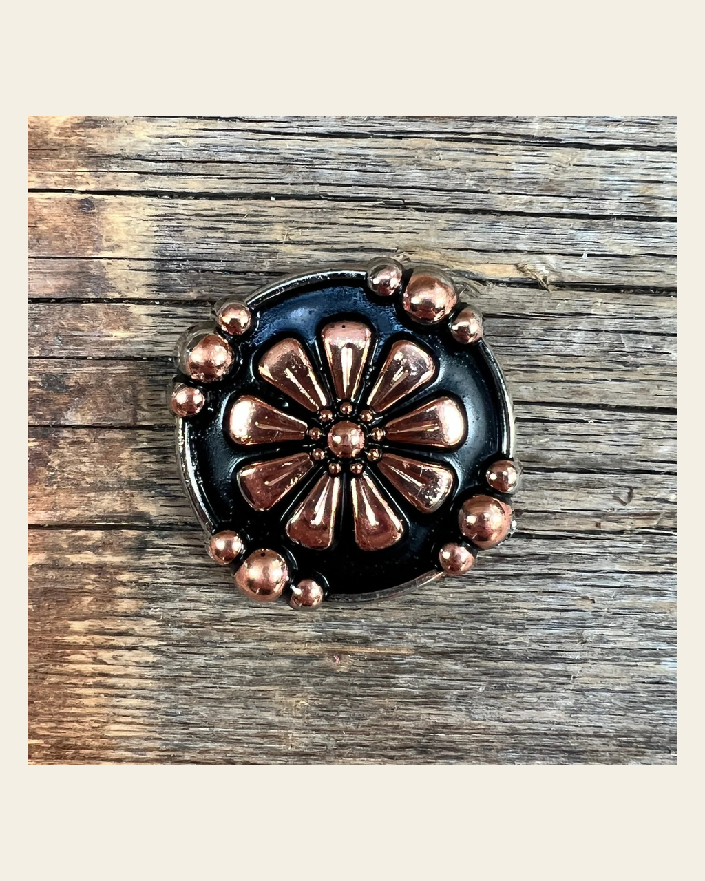 Copper Flower 1.25" Concho W196L on a warm cream background