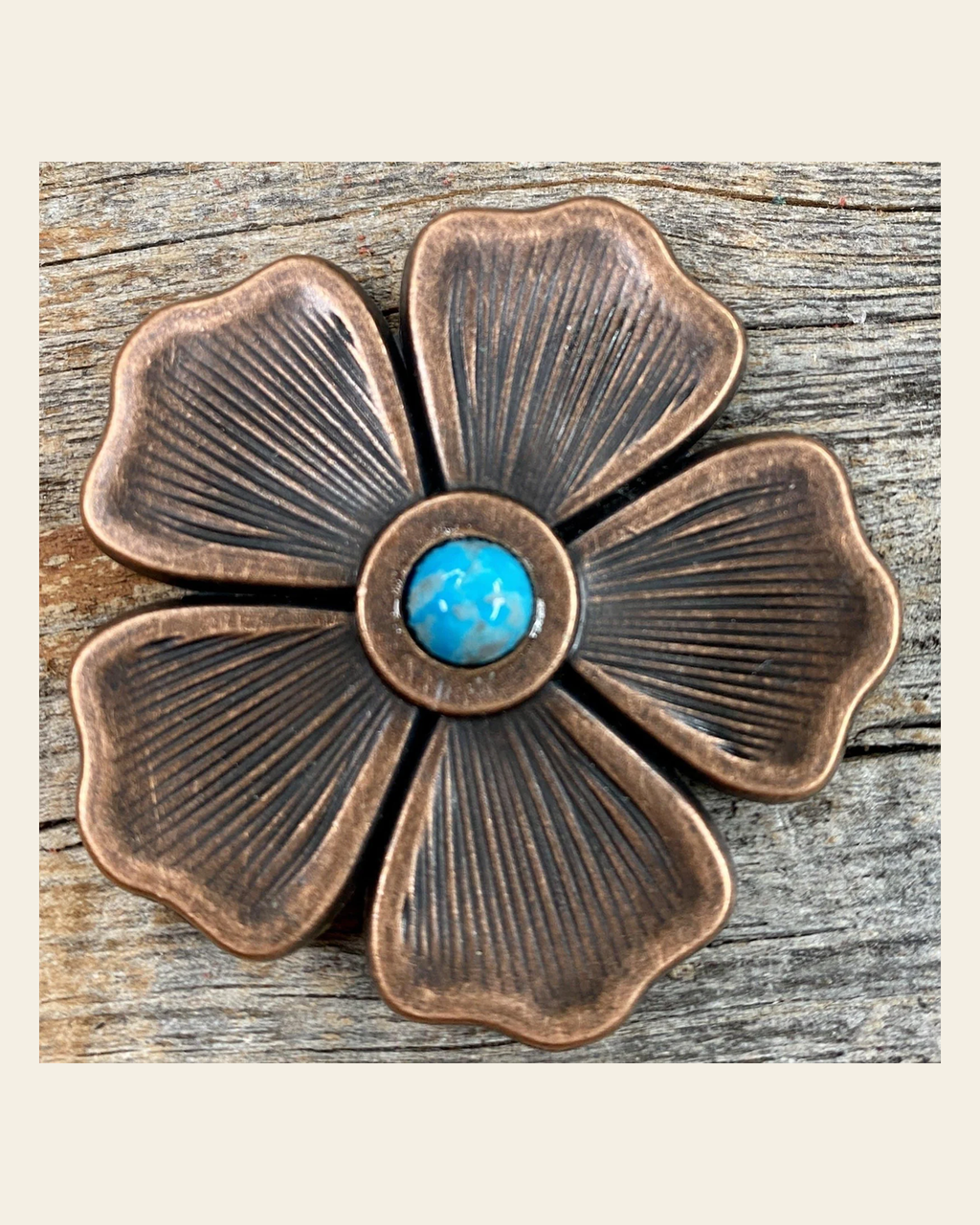 Copper Flower Turquoise Concho 2" W111L on a warm cream background