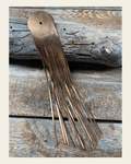 Copper Leather Fringe on a warm cream background