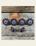 Copper Fuchsia AB & Lilac Saddle Conchos on a warm cream background