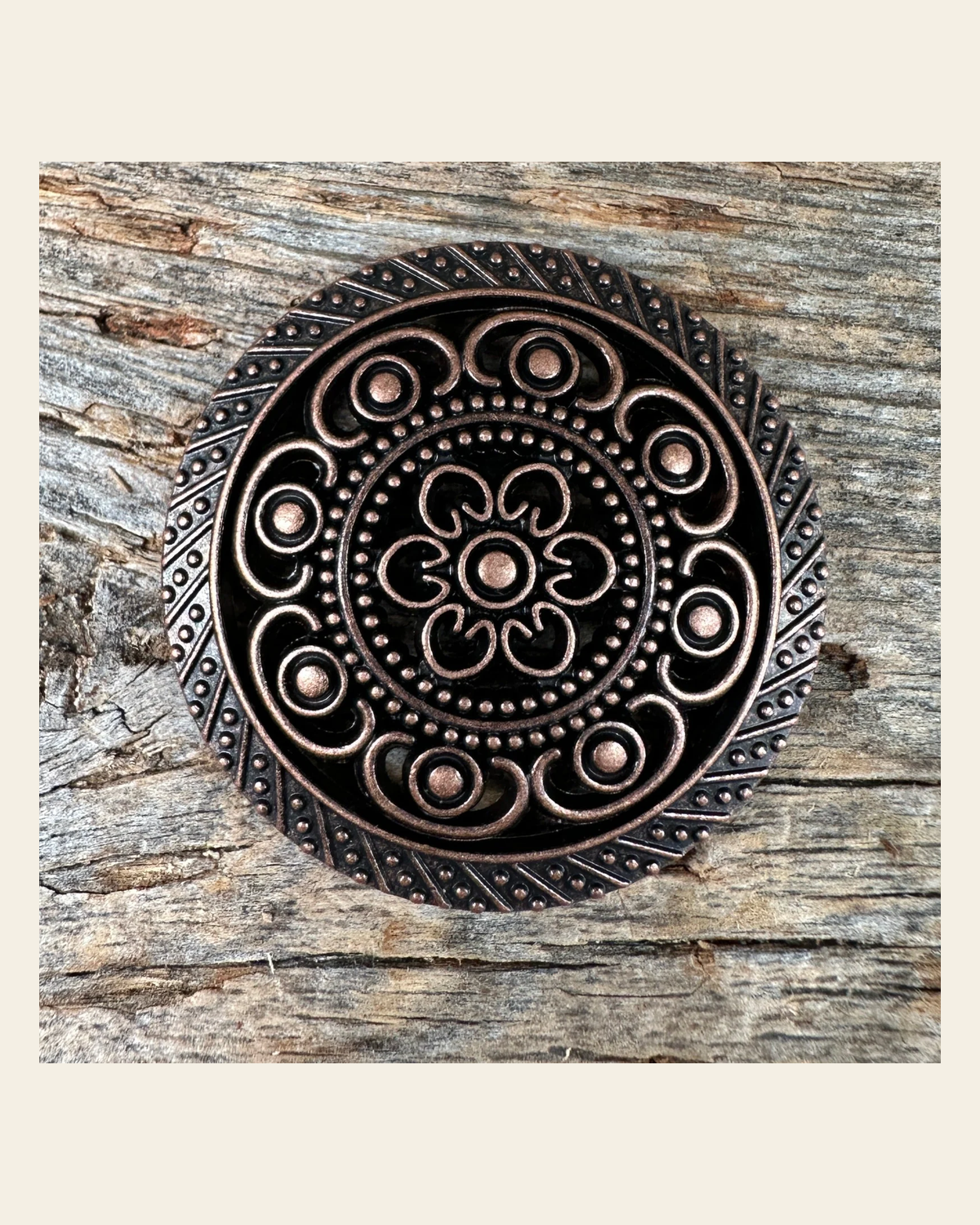 Copper Intricate Engraved Concho 1.5" W224L on a warm cream background