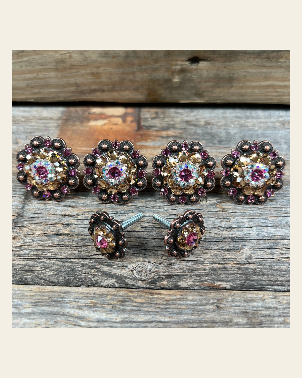 Copper Pink AB & Champagne Saddle Conchos on a warm cream background