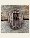 Copper RD Cart Buckle W218B on a warm cream background