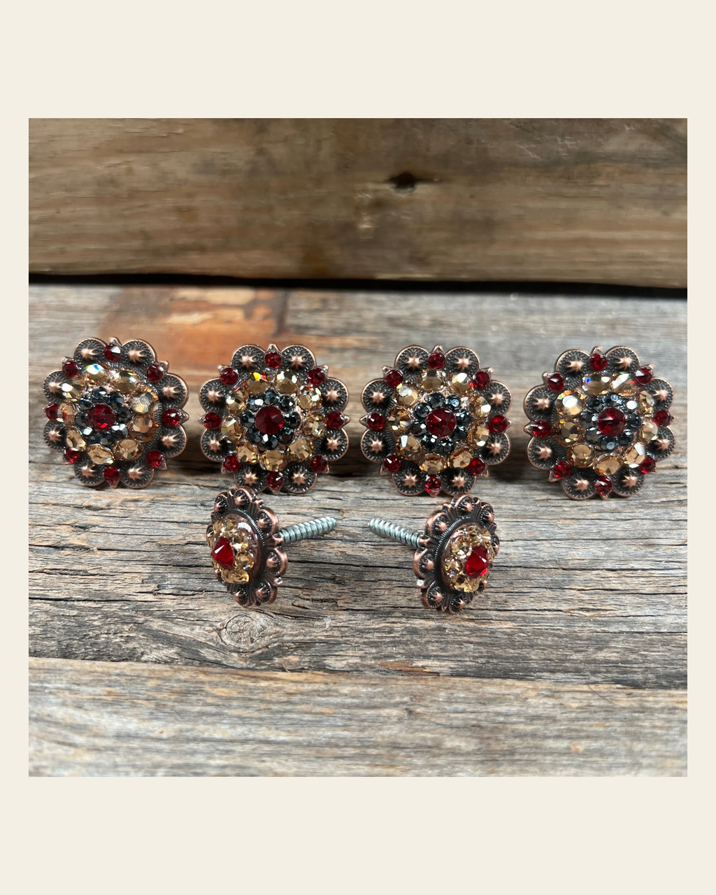 Copper Ruby Jet & Champagne Saddle Conchos on a warm cream background