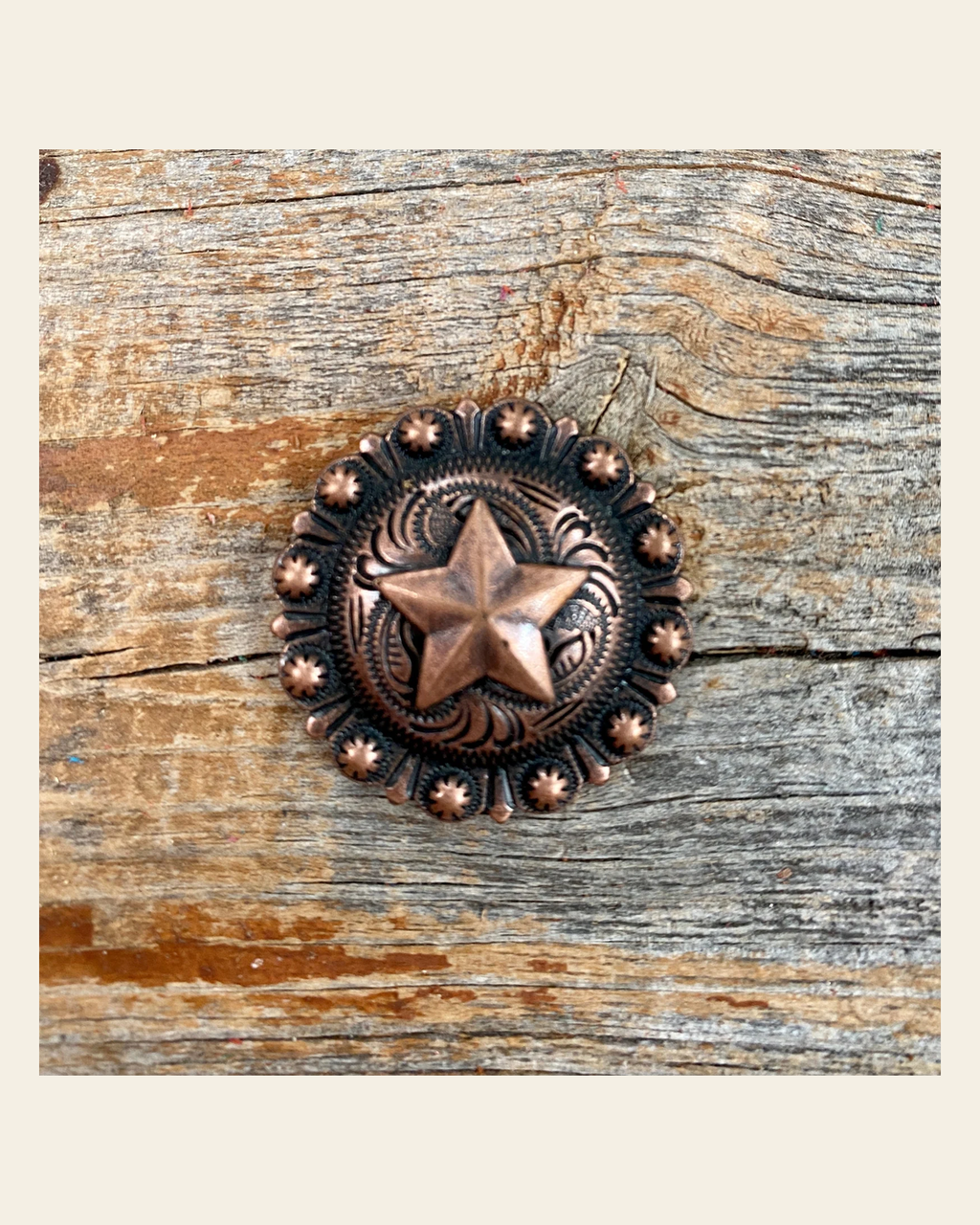 Copper Star Concho 1.25" W175L on a warm cream background