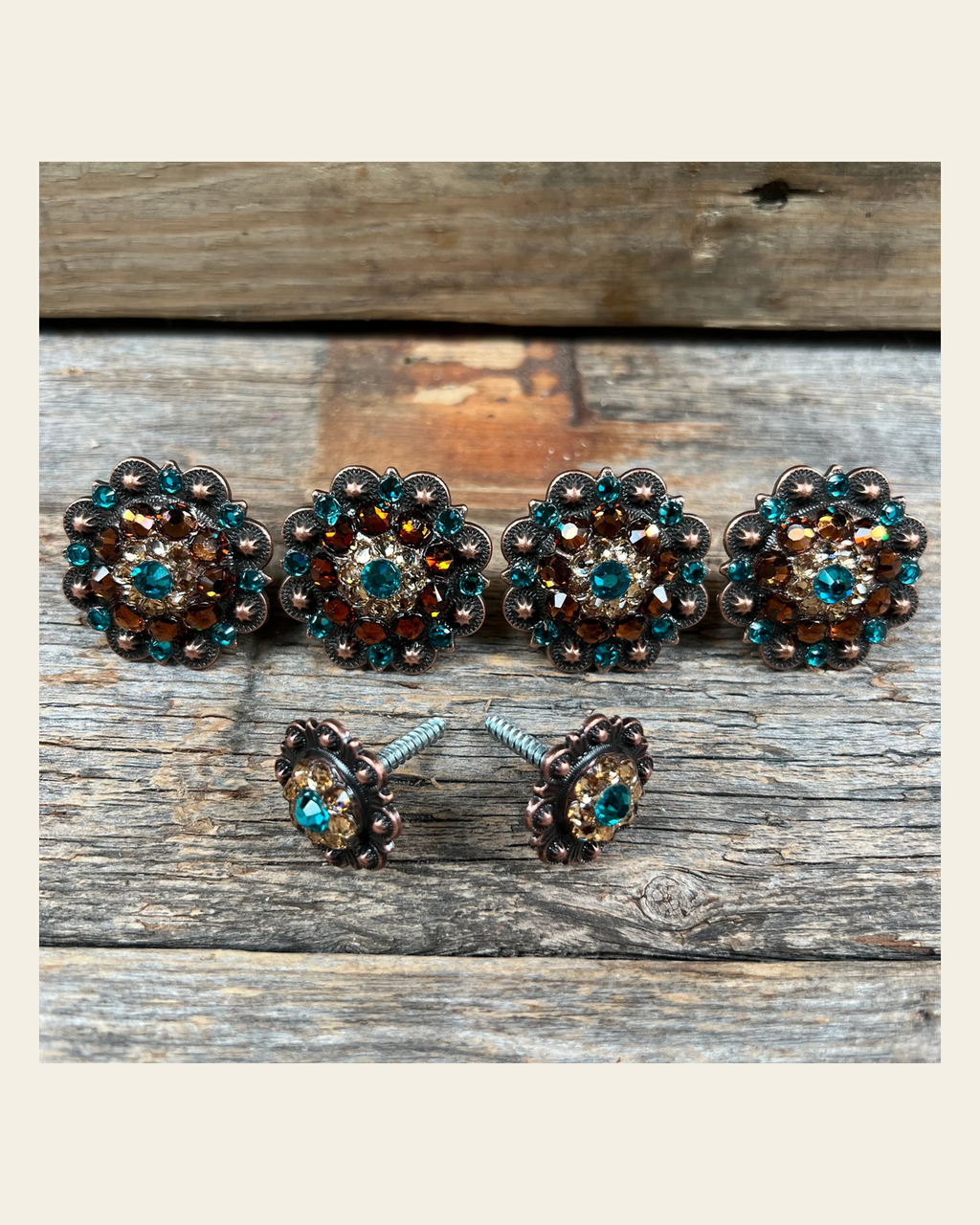 Copper Teal Champagne and Topaz Saddle Conchos on a warm cream background