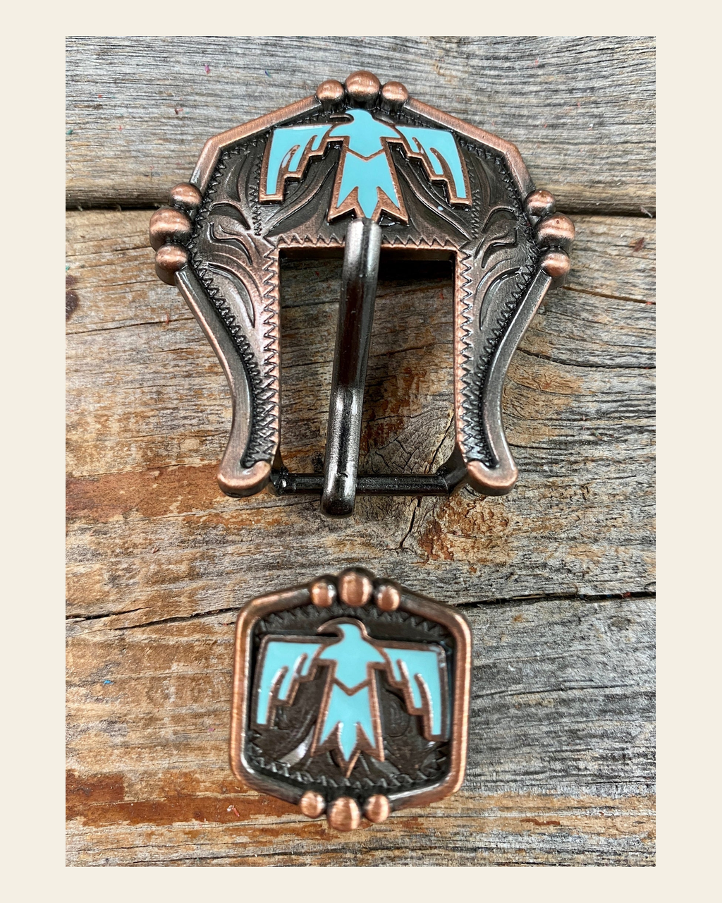 Copper Thunderbird Buckle W116B on a warm cream background