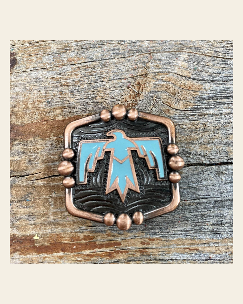 Copper Thunderbird Concho 1” W116S on a warm cream background