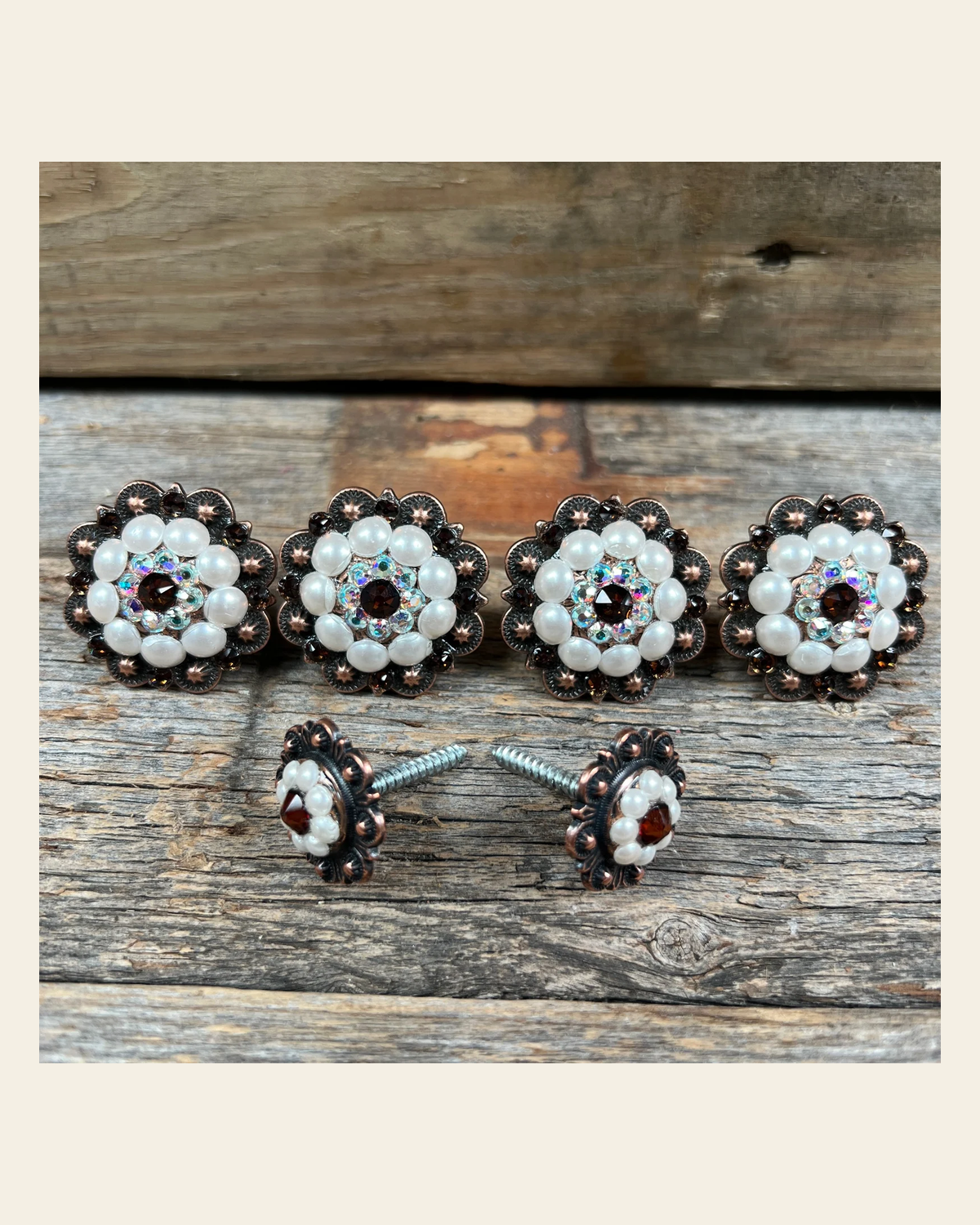 Copper Topaz AB & Pearl Saddle Conchos on a warm cream background
