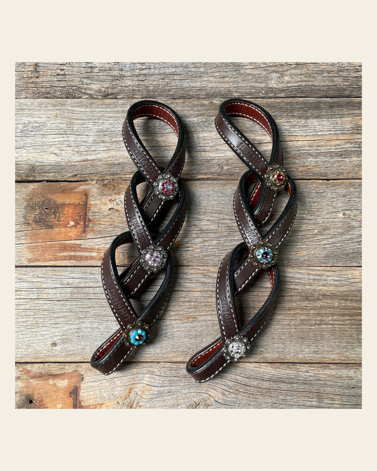 Crystal Dark Oil Rustic Tie Down Keepers on a warm cream background