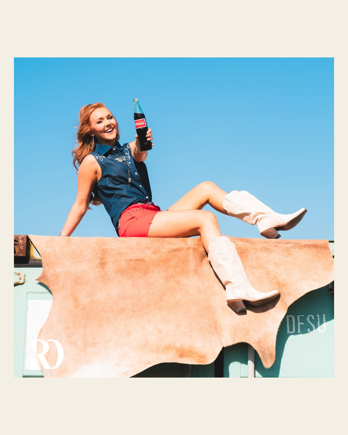 Dally Denim Sleeveless | Top on a warm cream background