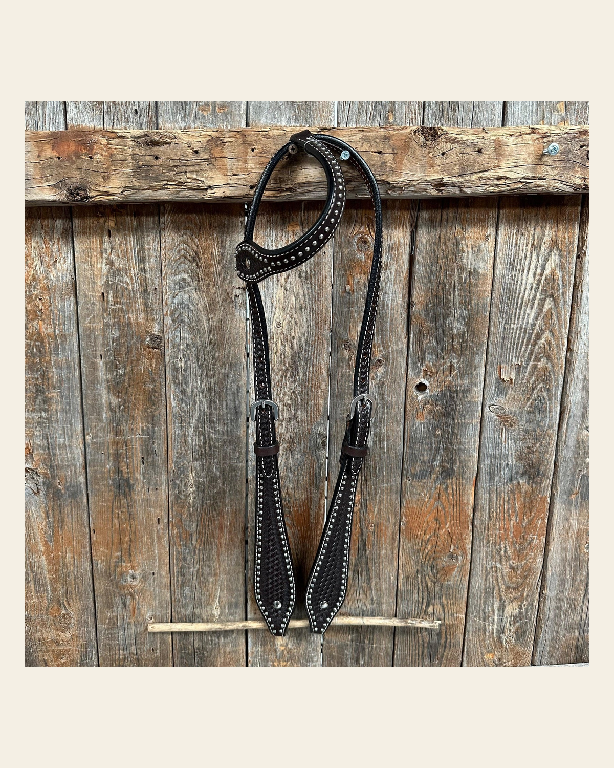 Dark Oil Basketweave with Silver Dots One Ear Headstall / Bridle on a warm cream background