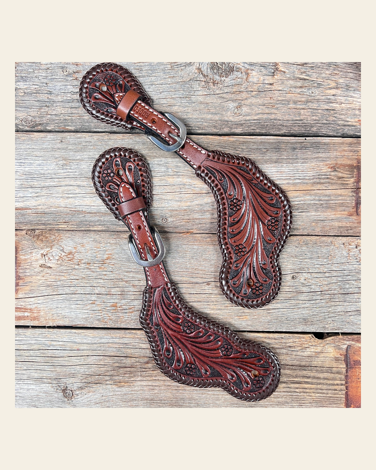 Dark Oil Braided Spur Straps #87052 on a warm cream background
