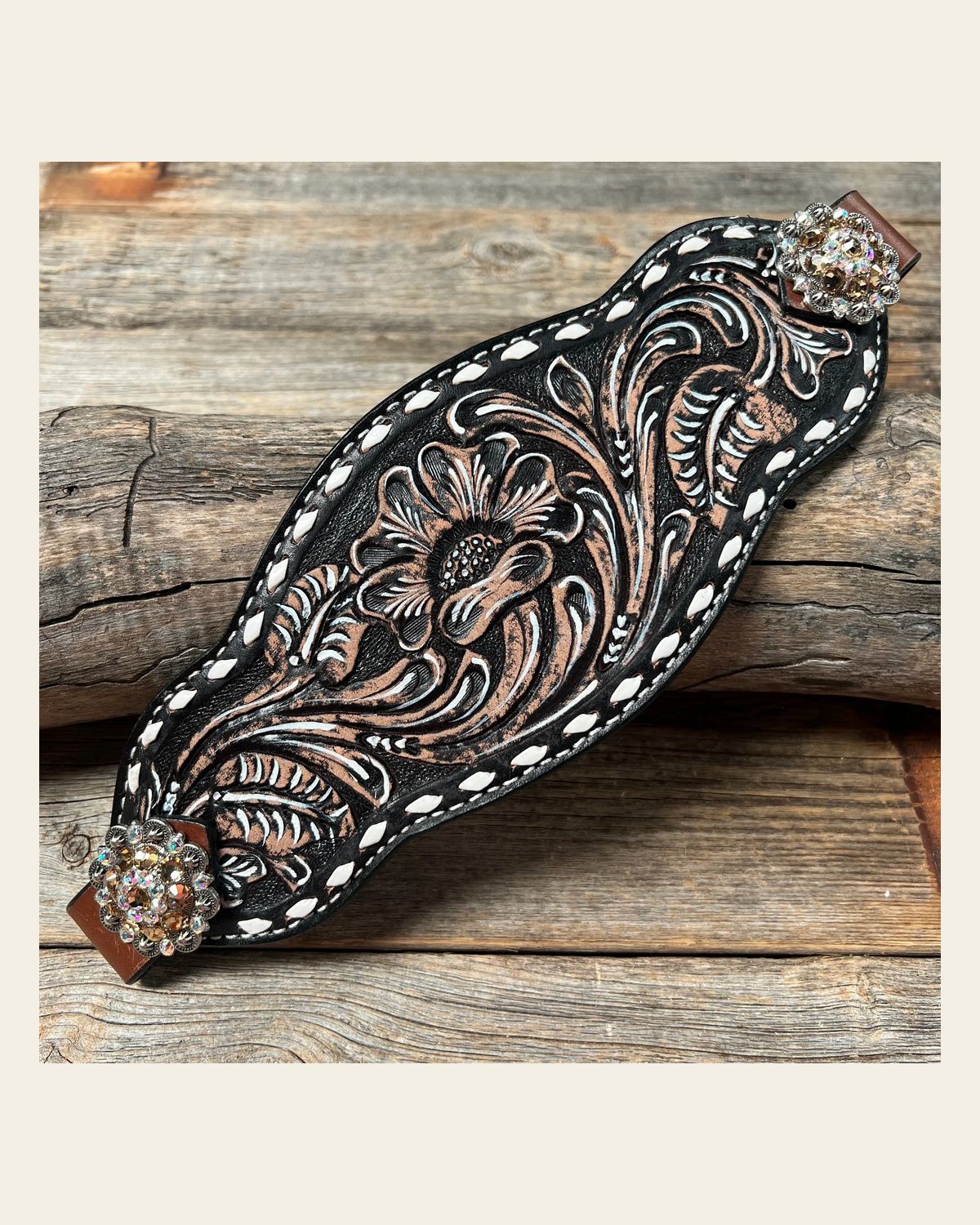 Dark Oil Buckstitch Bronc Noseband With Antique Silver Conchos on a warm cream background