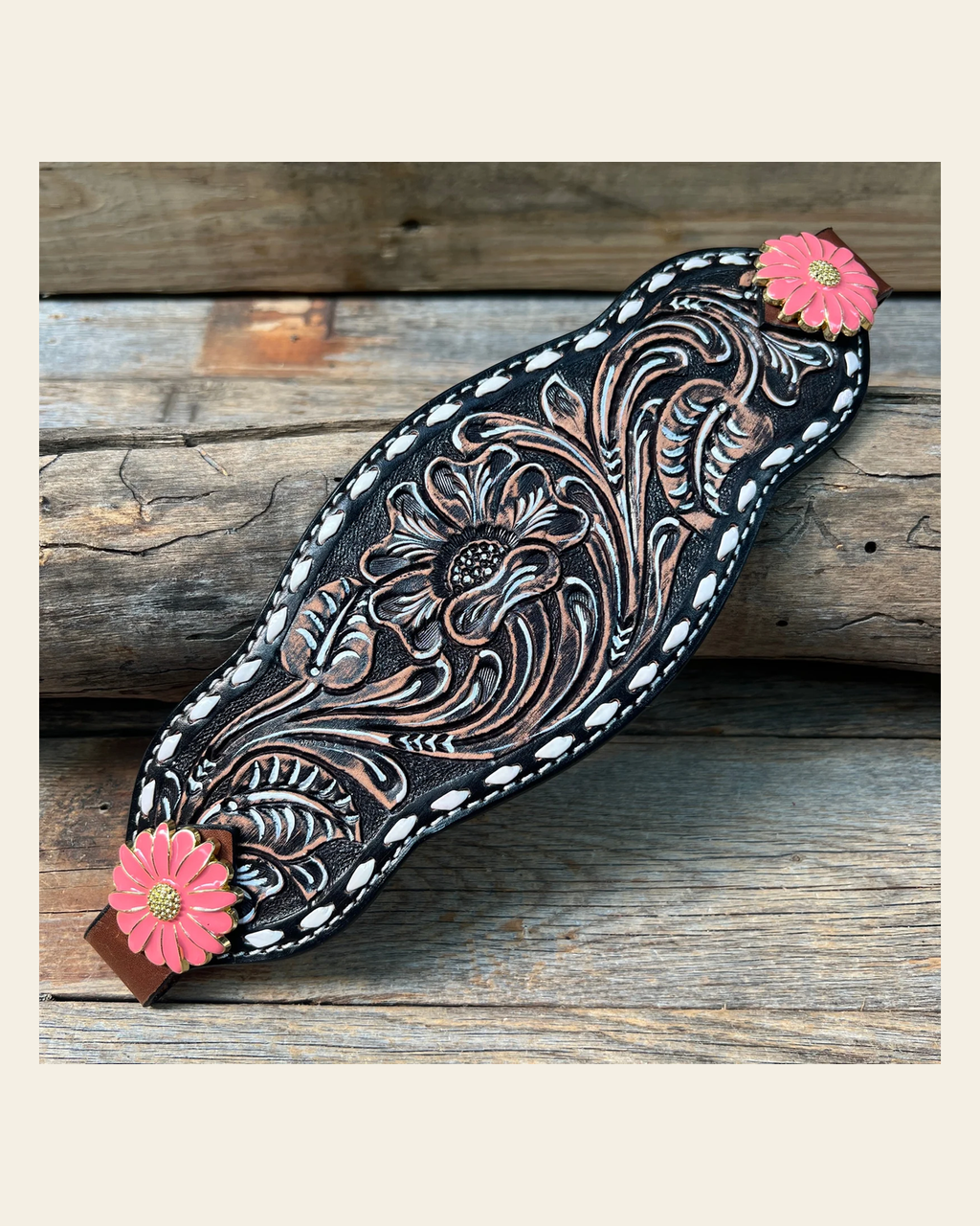 Dark Oil Buckstitch Bronc Noseband With Pink Flowers Conchos on a warm cream background