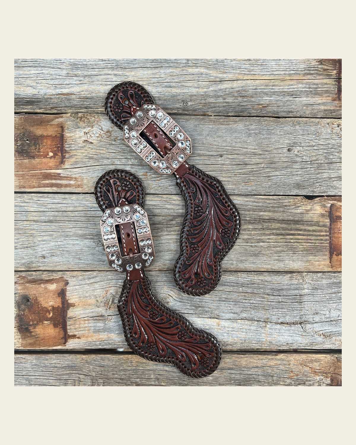 Dark Oil Whipstitch Clear Spur Straps #SS129 on a warm cream background