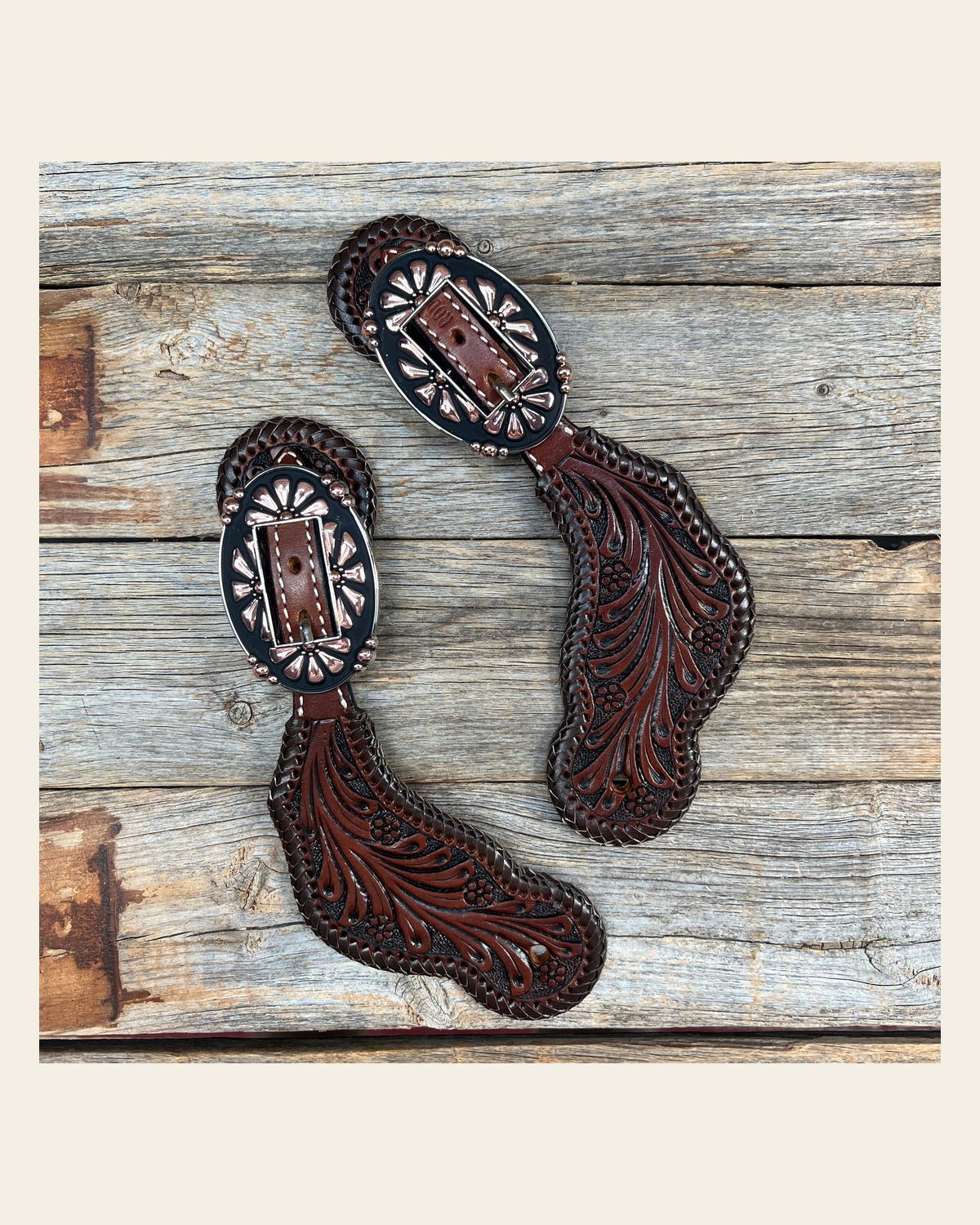 Dark Oil Whipstitch Copper Flower Spur Straps - Copper Flower #SS124 on a warm cream background