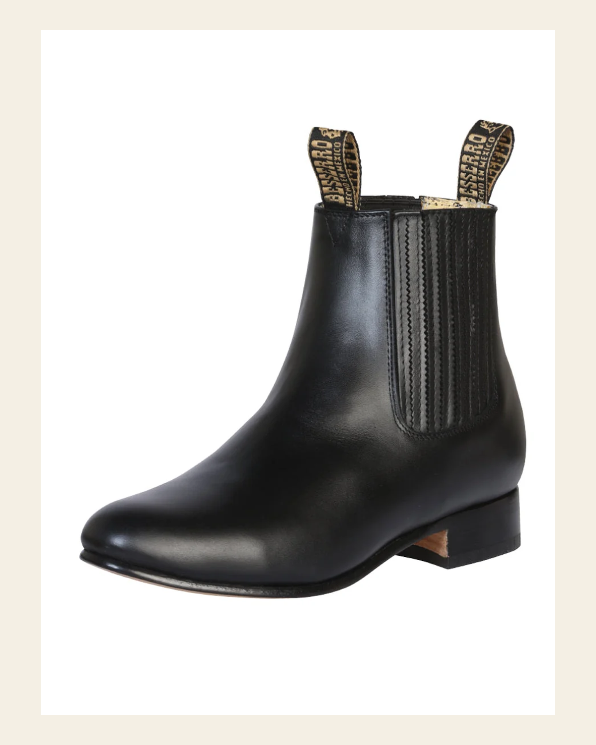 El Besserro Charro Men's Leather Cowboy Ankle Boot - Made in Mexico - Black 207 on a warm cream background
