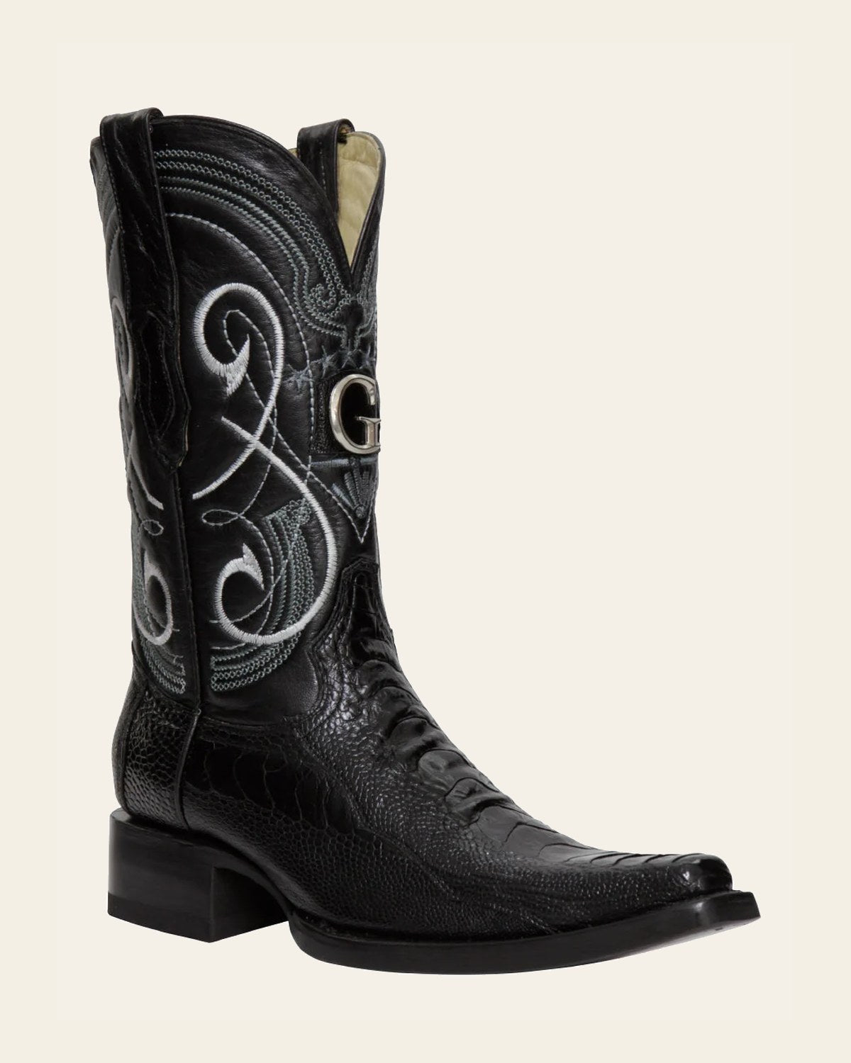 El General Men's Exotic Ostrich Leg Cowboy Boots - Black 45067 on a warm cream background