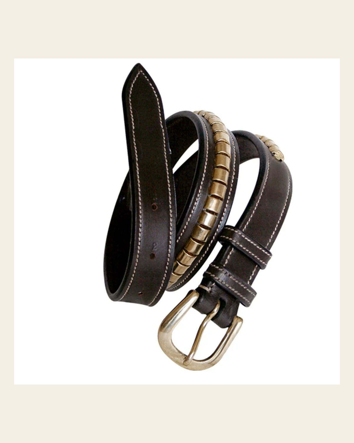 ExionPro Brass Clincher Belts on a warm cream background