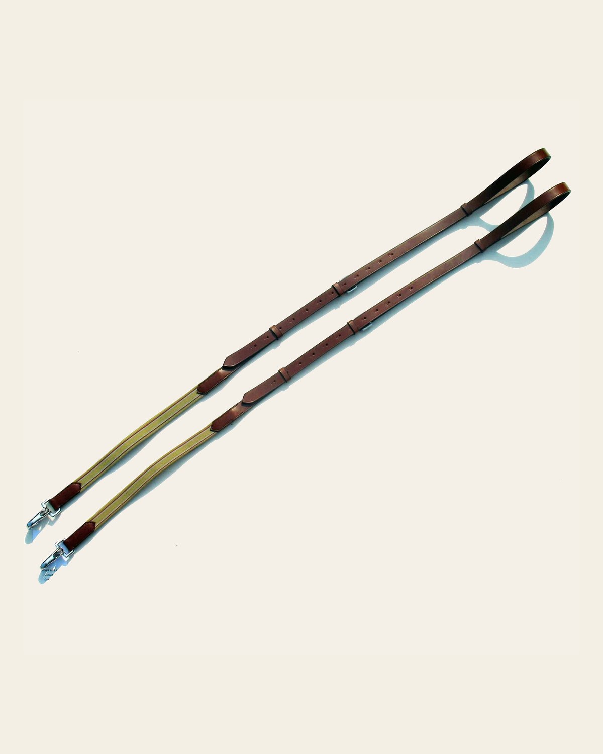 ExionPro Elastic Side Reins on a warm cream background
