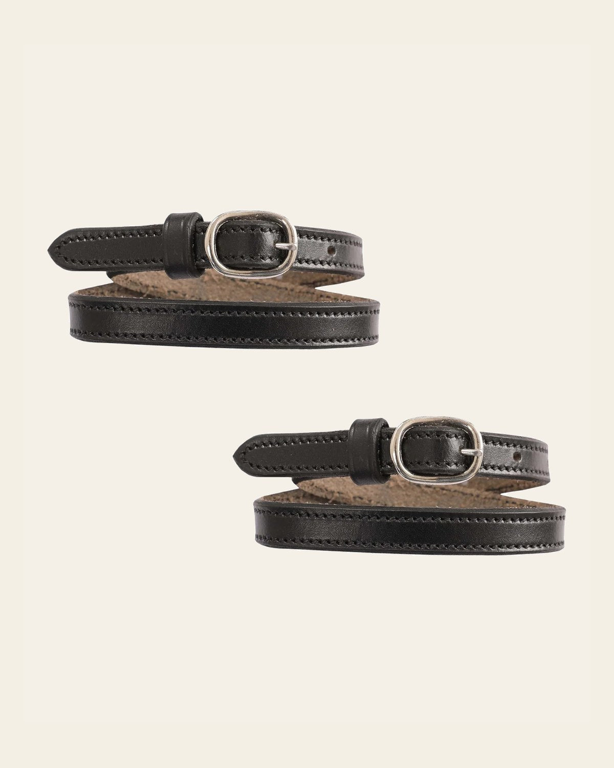 ExionPro English Spur Straps on a warm cream background