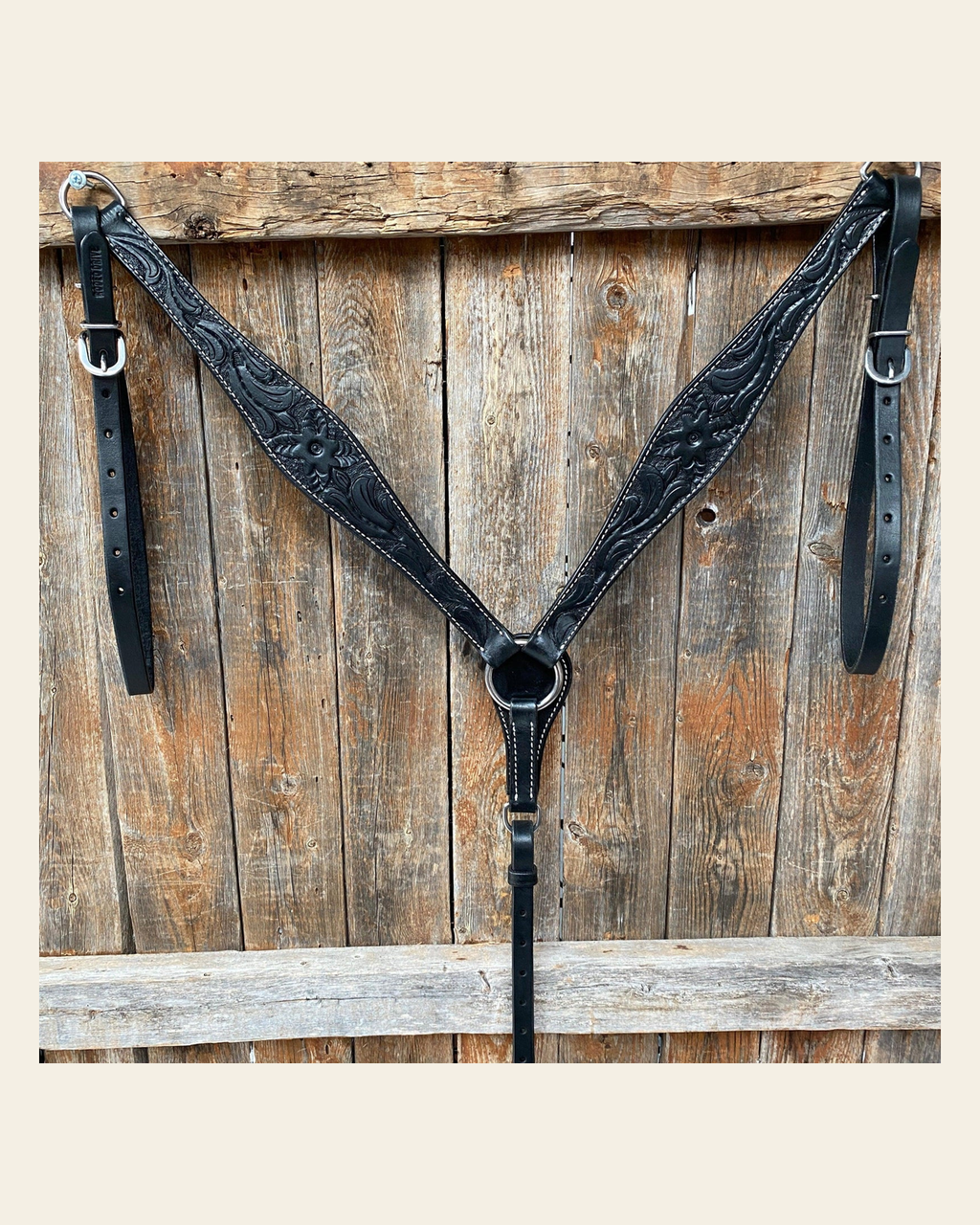 Floral Tooled Black Breastcollar on a warm cream background