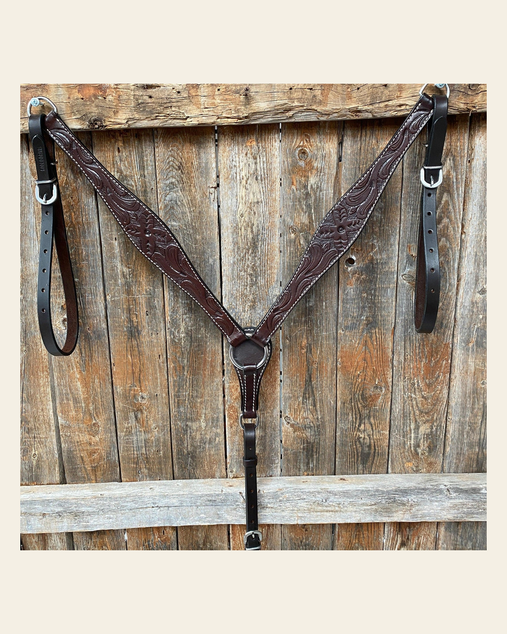 Floral Tooled Dark Oil Breastcollar on a warm cream background