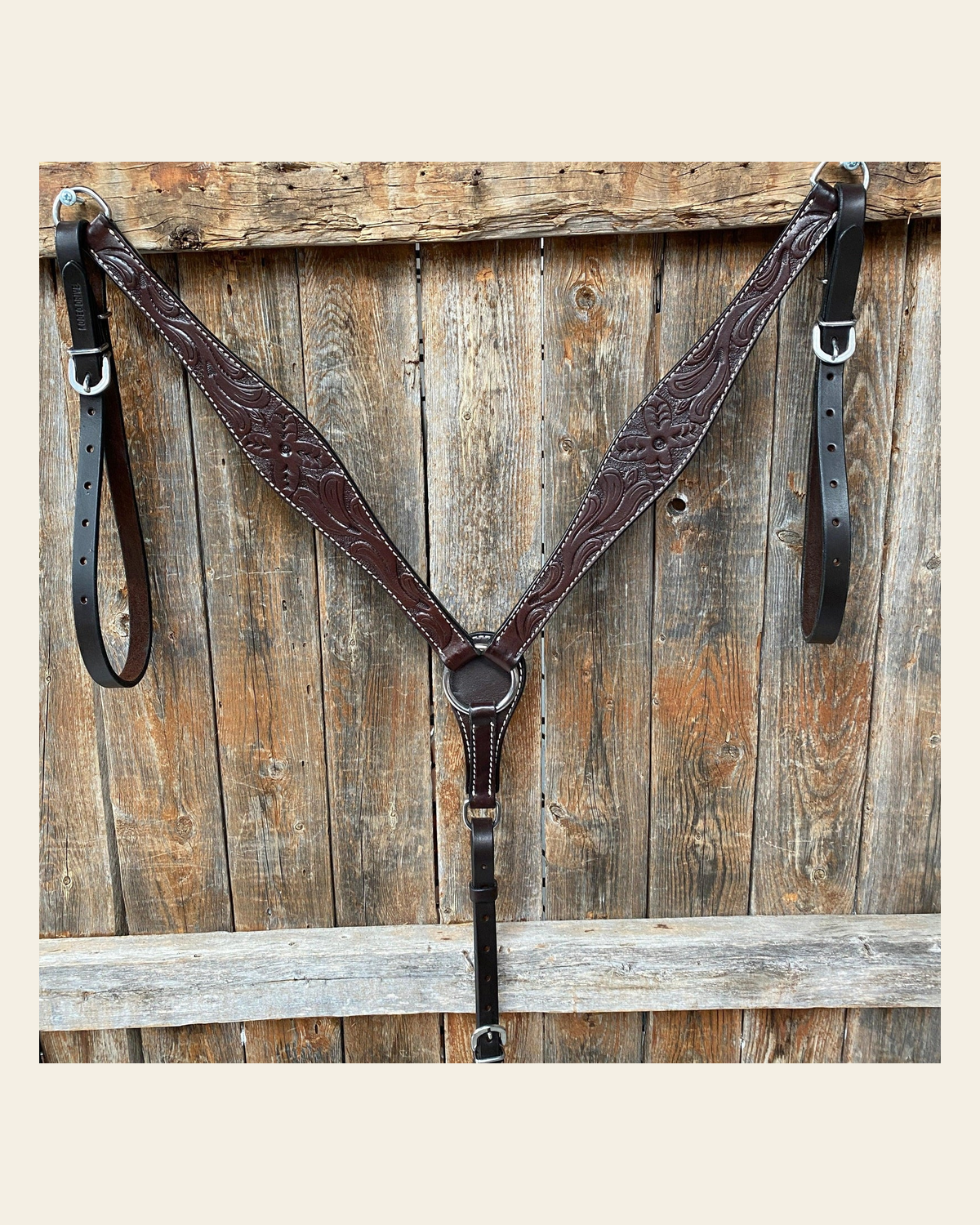 Floral Tooled Dark Oil Breastcollar on a warm cream background