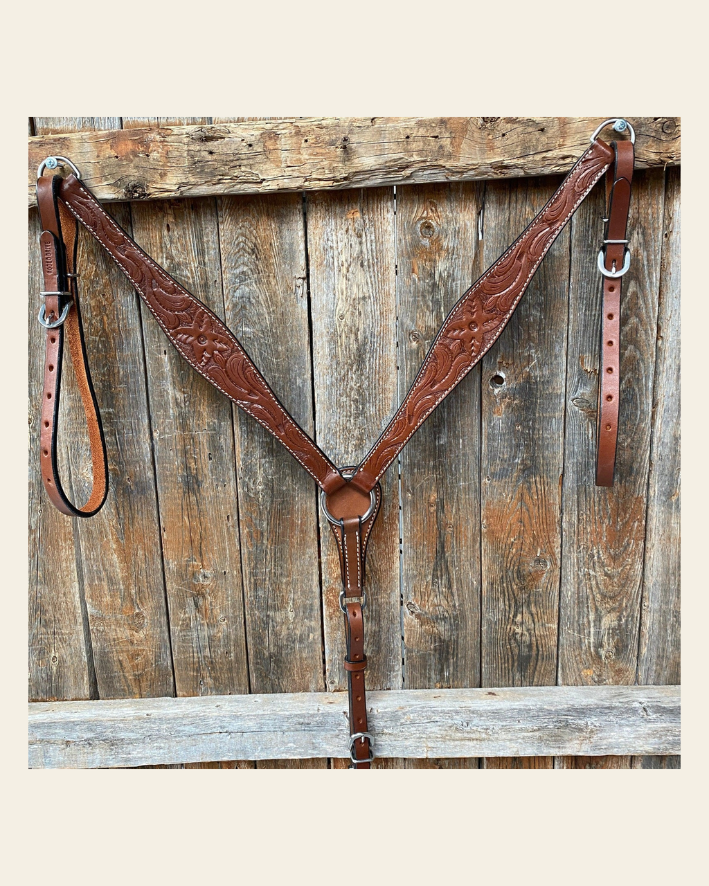 Floral Tooled Medium Oil Breastcollar on a warm cream background