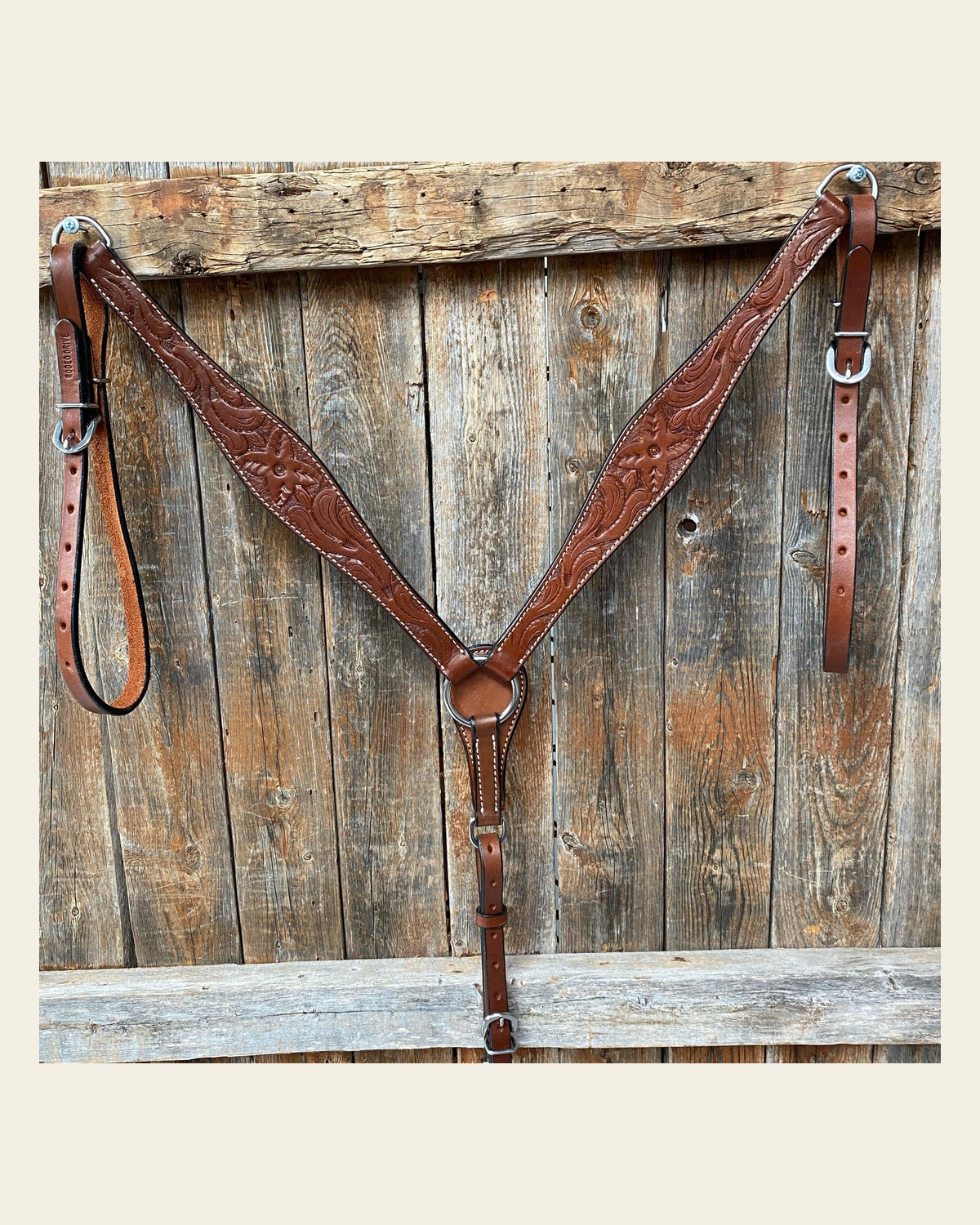 Floral Tooled Medium Oil Breastcollar on a warm cream background