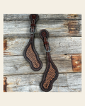 Foxtail Tooled Spur Straps on a warm cream background