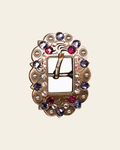 Fuchsia, AB & Lilac Copper European Crystal Cart Buckle on a warm cream background