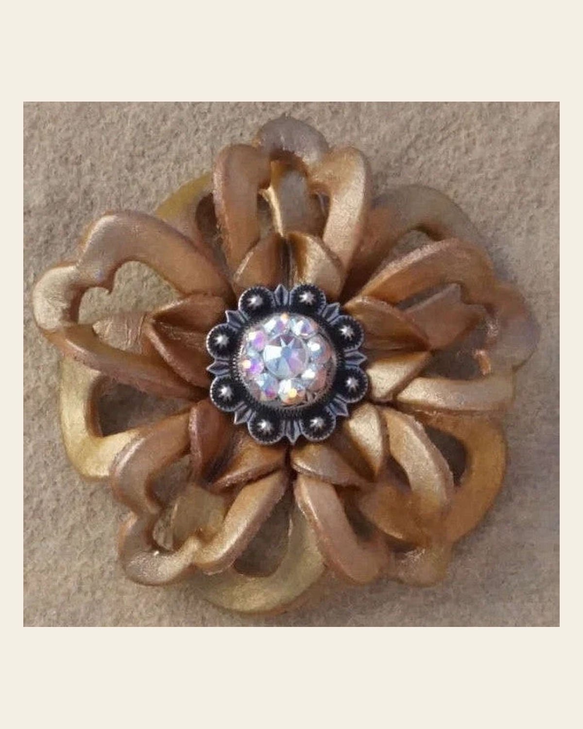 Gold Lotus Flower With Antique Silver AB 1" Concho on a warm cream background